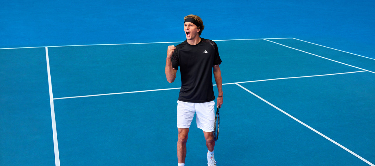Alex Zverev on a tennis court modelling the new Adidas 2023 Australian Open tennis clothing
